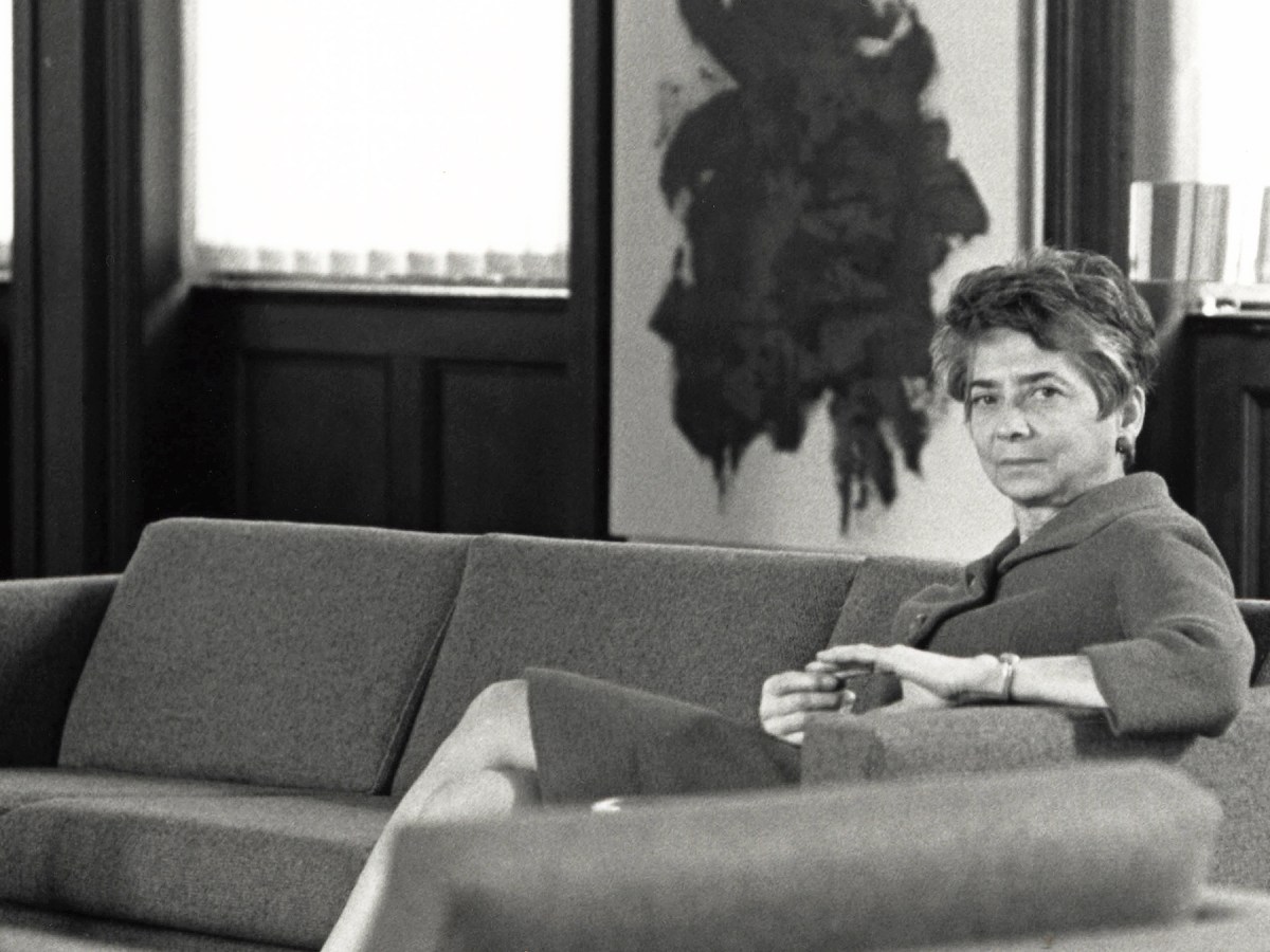 Black-and-white photograph of Esther Gottlieb sitting on a couch.